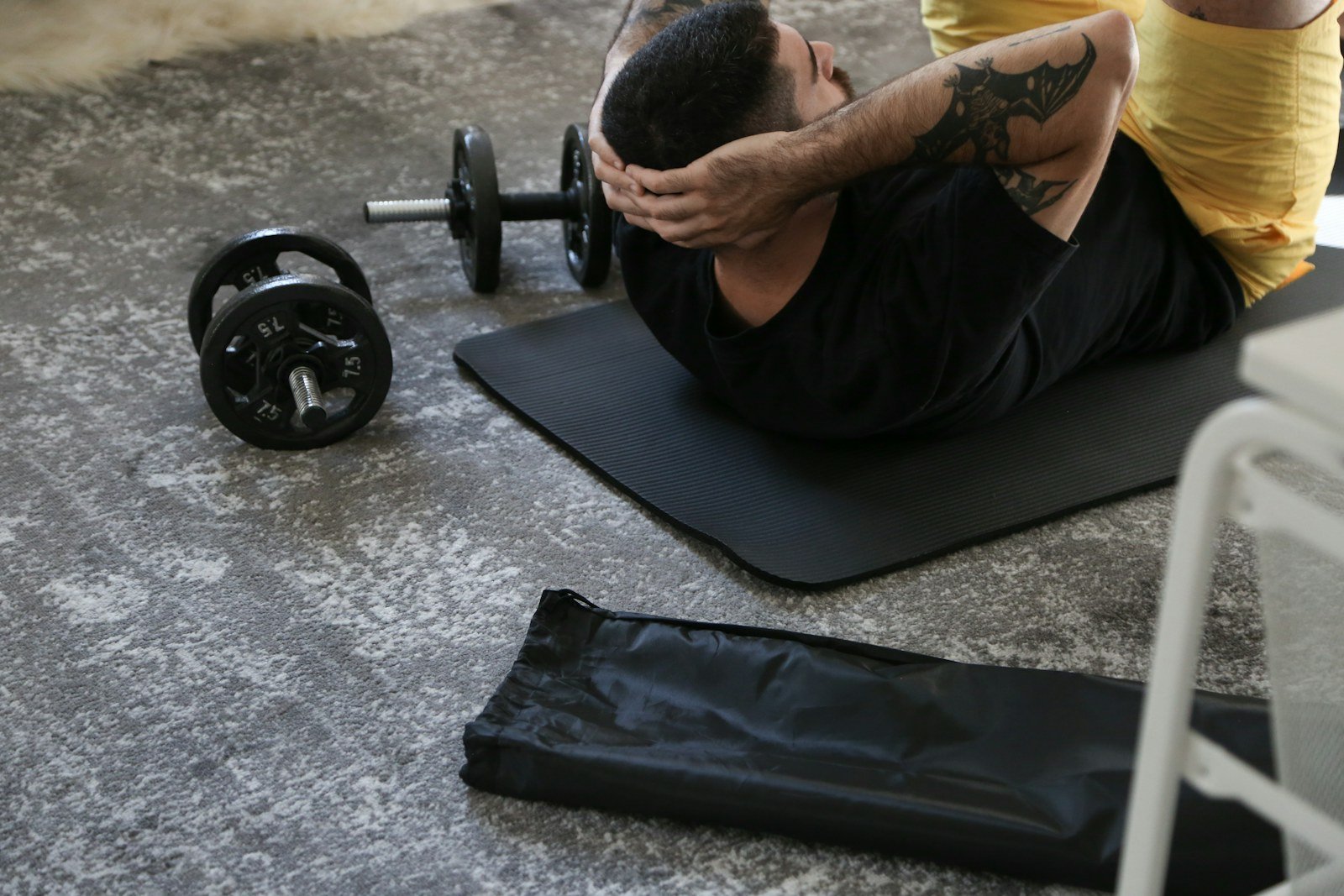 Athlete working on the floor during a recovery session in the gym
