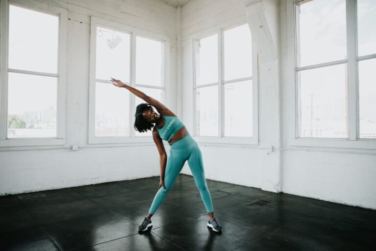 Athlete practising controlled mobility exercises in a gym