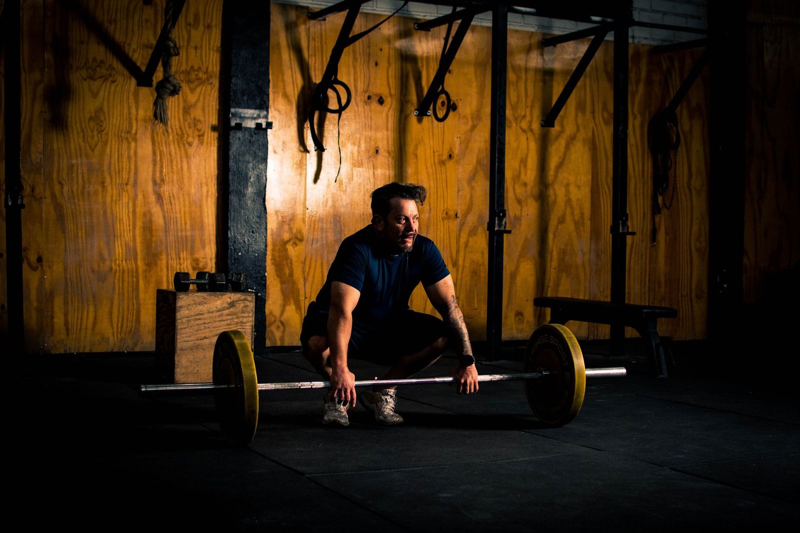 Athlete preparing a barbell after a recovery period