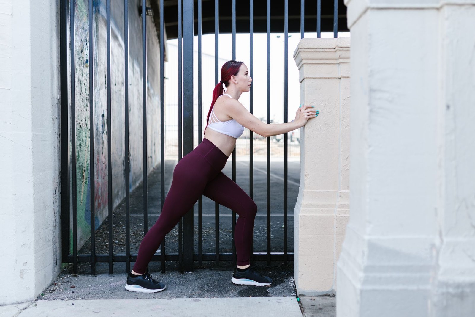 Runner performing a calf stretch after running