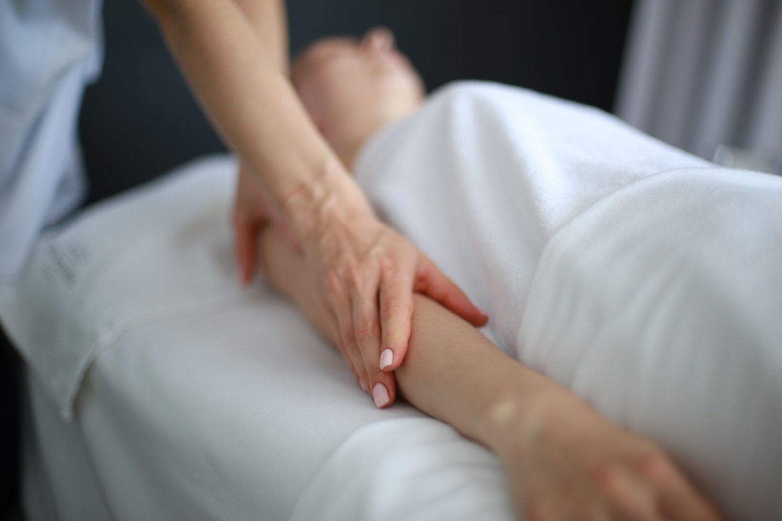 Athlete using a massage gun after training