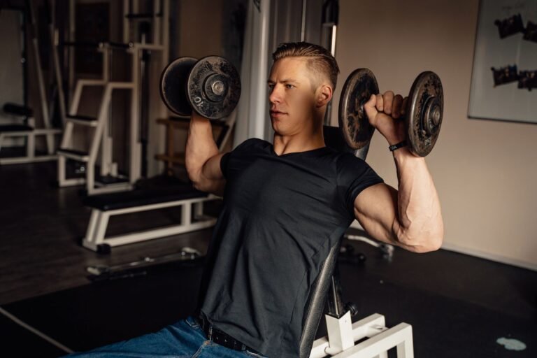 Athlete pressing a weight overhead with controlled shoulder position