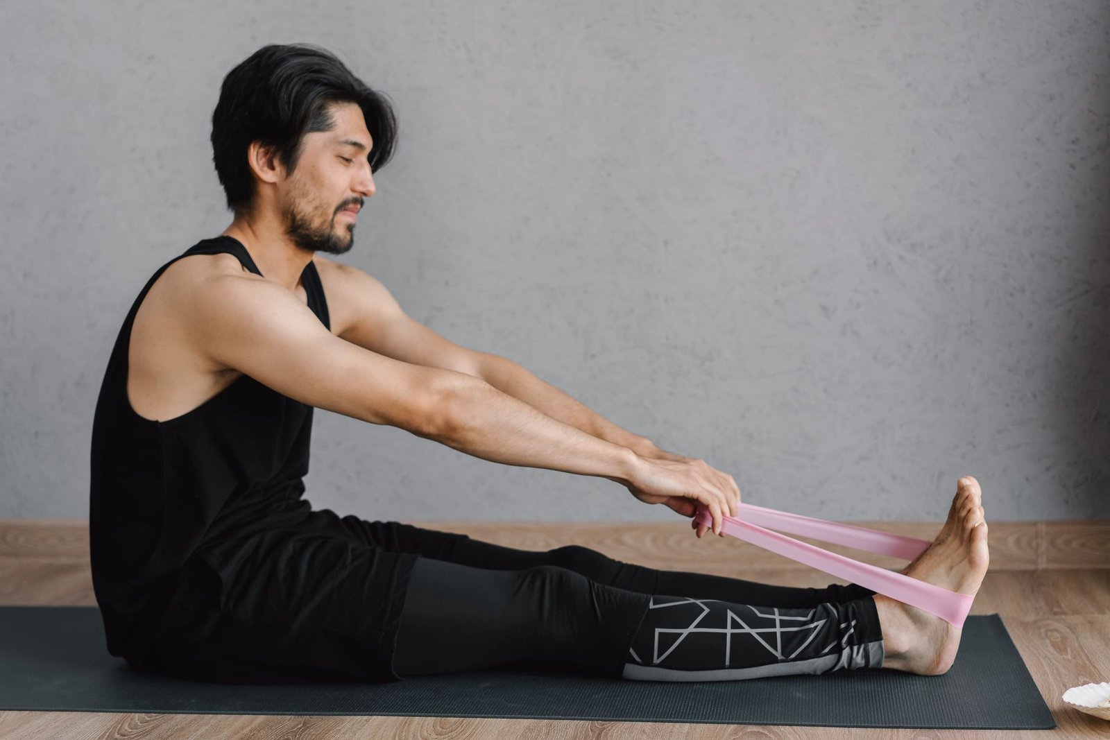 Athlete using a resistance band during a home training session