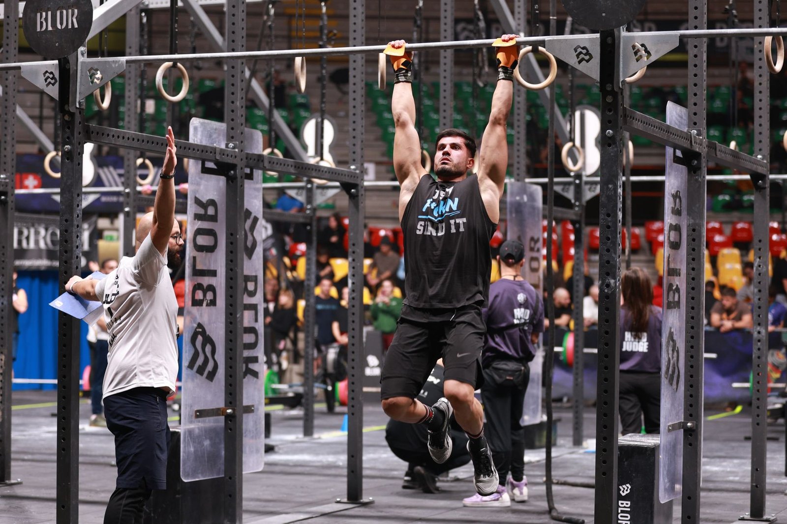 Athlete rehearsing a squat during a strength warm-up
